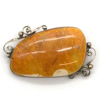 Large natural amber butterscotch designer brooch, hand-polished, set in silver, 20th century.