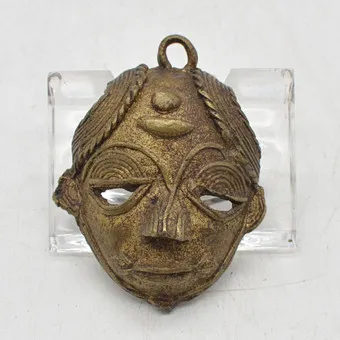 Brass pendant, African mask, handmade, 20th century, approx. 55 x 41 mm.