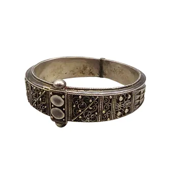 SILVER BANGLE WITH FILIGREE WORK AND HINGE CLASP.