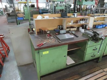 1 workbench, approx. 180 x 90 cm, 2 base cabinets, 1 hinged door, 1 x 3 drawers, mounted vice