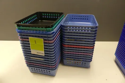 Lot of plastic storage baskets, various colours