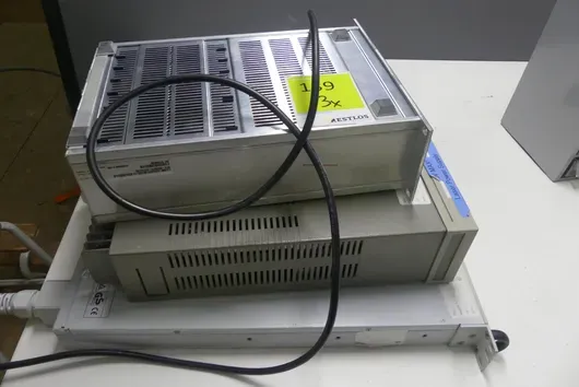 Laboratory electronics assortment (MKS vacuum gauge controller, HP E3615A DC power supply, Lambda Genesys power supply)