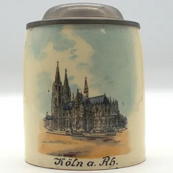 CHOPE À BIÈRE ANCIENNE EN GRÈS AVEC COUVERCLE EN ÉTAIN POUR 1/8 LITRE REPRÉSENTANT LA CATHÉDRALE DE COLOGNE.