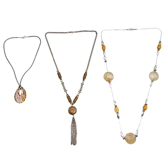 3-PART JEWELRY LOT WITH CORD CHAIN, TASSEL PENDANT AND AMBER-COLORED ELEMENTS.