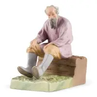 Figuur 'Oude man op een houten bank'