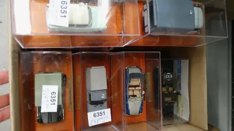 2 boxes of model cars