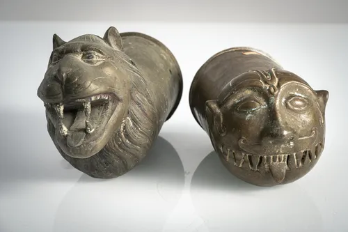 Two bronze replicas or palanquin finials