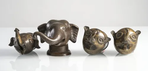 Four palanquin finials in (partly stylized) elephant head form,