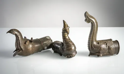 Three large palanquin finials in the form of stylized elephants,