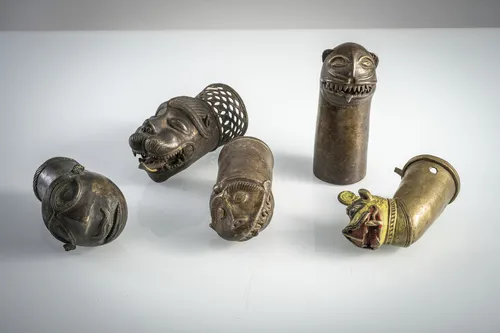 Five litter finials shaped as mythological creatures