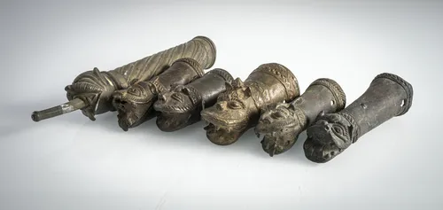 Six small bronze litter finials