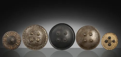Group of five shields, partly made of metal or leather