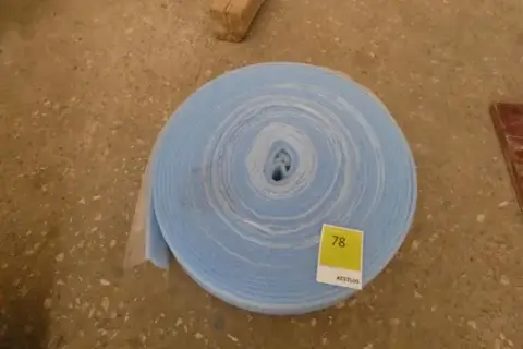 Roll of edge insulation strip