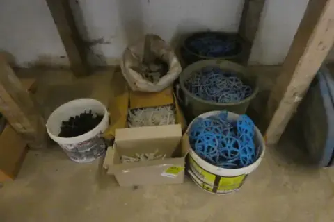 Mixed lot of reinforcement spacers and insulation dowels in buckets, boxes and sack