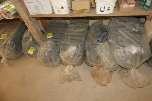 Lot of bags with plastic spacer tubes and cones for formwork