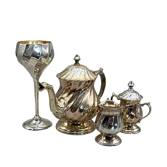 Four-piece metal service set, baroque style