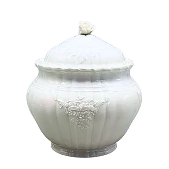 KPM. Porcelain lidded box with floral decoration.