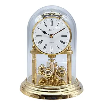 Hermle. Draaiende penduleklok met glazen stolp - quartz uurwerk.