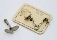 Paar Manschettenknöpfe, um 1920, silberfarben.