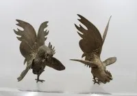 Paar vechthanen, messing, ca. H 21,5 cm