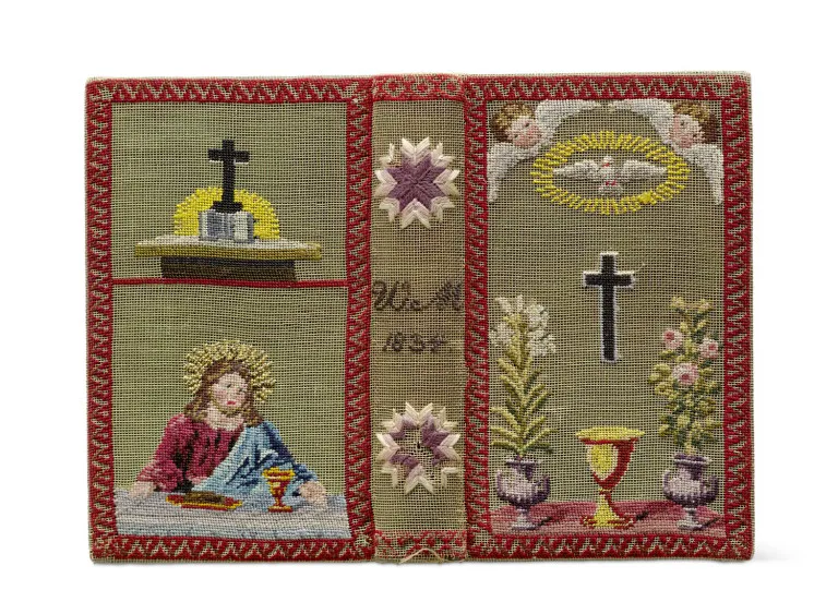 Binding embroidered in colour with Christian symbols