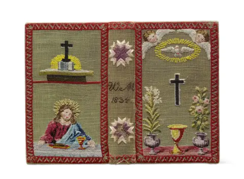 Binding embroidered in colour with Christian symbols