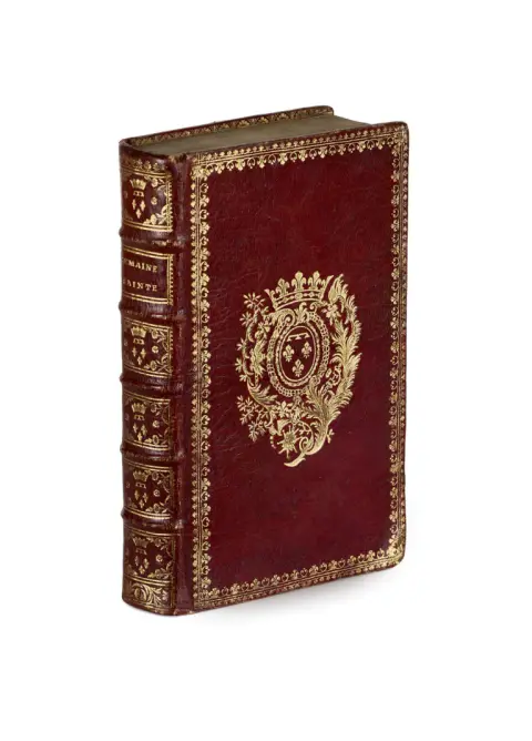 Burgundy leather binding with rich gilt tooling on the spine, gilt-stamped floral border frame
