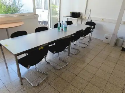 10 cantilever chairs, black fabric upholstery, partly worn