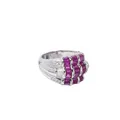 Wide white gold band ring with rubies and diamonds.