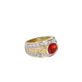 Yellow gold band ring with floral motif and central rhodolite.
