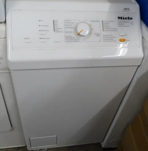 1 стиральная машина с вертикальной загрузкой Miele