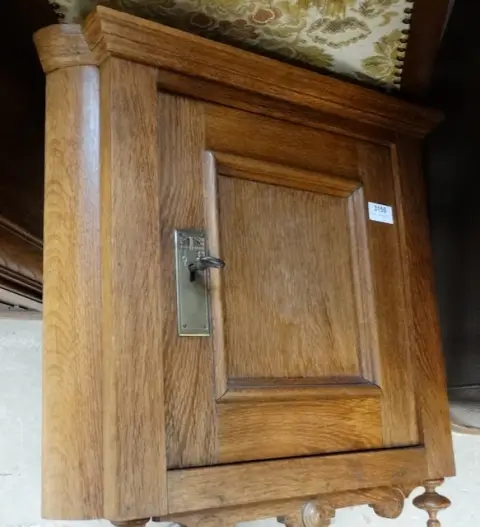 1 small corner cabinet