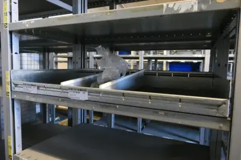 Mixed lot of warehouse and operational equipment, including storage boxes, material and HEWI items