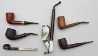 7 assorted pipes, some marked, 1 porcelain, approx. L 24.5 cm