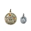 Deux pendentifs à pièces avec motifs religieux.