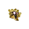 Bladvormige broche