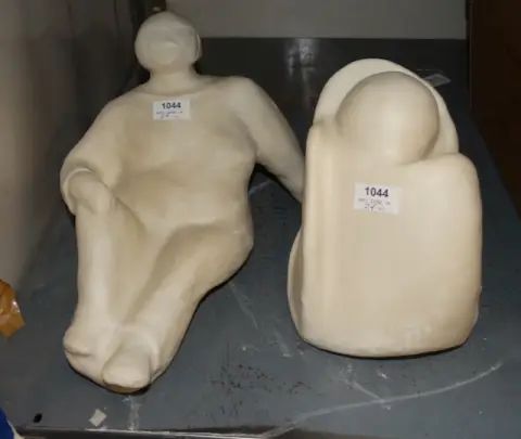 2 stone figures