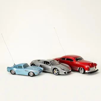 Three RC models: 1950 Mercury, Porsche Carrera GT and Disney Pixar Cars Aston Martin (3).