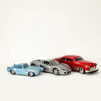 Three RC models: 1950 Mercury, Porsche Carrera GT and Disney Pixar Cars Aston Martin (3).