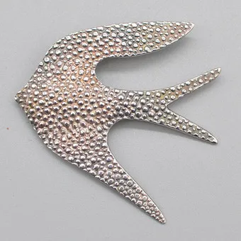 PAUL WUNDERLICH (1927-2010). "SILBERVOGEL", artist jewellery, pendant and brooch, sterling silver, signed and numbered, 1990s.