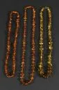 Barnsteenketting, 3 stuks – talrijke in de lengte bewerkte stenen, L= ca. 60-72 cm