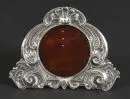 Standing picture frame – 925 silver, approx. 80 g, curved frame with richly embossed decorations, stand on red plastic plate, H= 9…