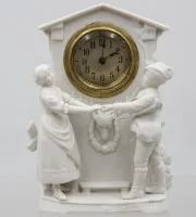 Tischuhr aus Biskuitporzellan, Werk steht, 1x bei Figur Kopf geklebt, ca. H-17,5cm B-12,5cm