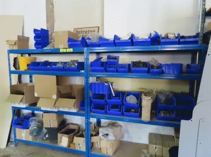 2 metal shelving units, each approx. 1.80 m x 1.50 m, plug-in system, blue, 1 lot of fastening material in storage bins, consisting of: cover caps, plastic, post clamps, starter clamps, middle clamps, corner clamps, galvanised, anthracite and moss green (item 17)