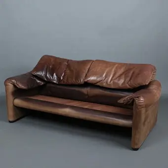 VICO MAGISTRETTI. Cassina. Zweisitzer / Couch, Modell 'Maralunga', Stahl, Leder, Entwurf 1973, Italien.