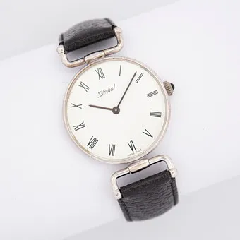 Vintage armbåndsur af mærket Symbol, »Swiss Made«, sort læderrem, manuelt optræk.