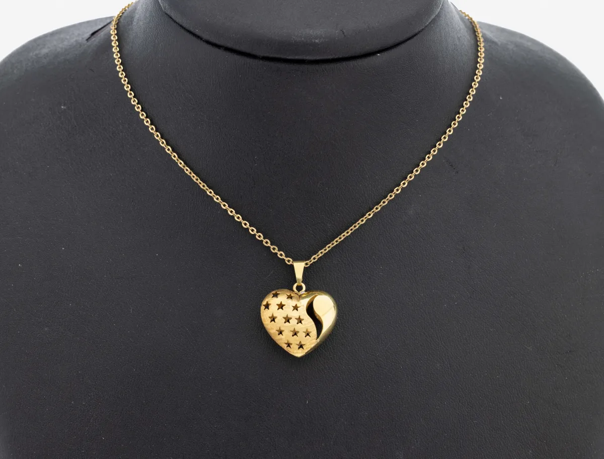 14 kt gold pendant, YG 585/000, part. struct., heart, openworked with stars, on