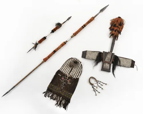 Four Naga items: spear and short spear, axe and decorative panel with shells