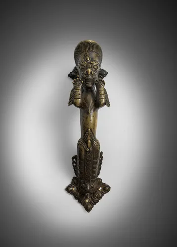 Bronzen handgreep in de vorm van een vruchtbaarheidsgodheid