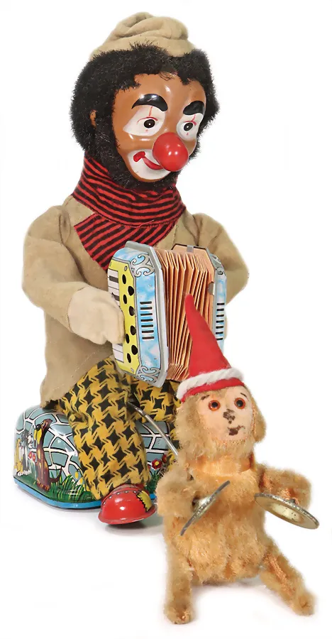 Jouet à batterie, clown avec singe